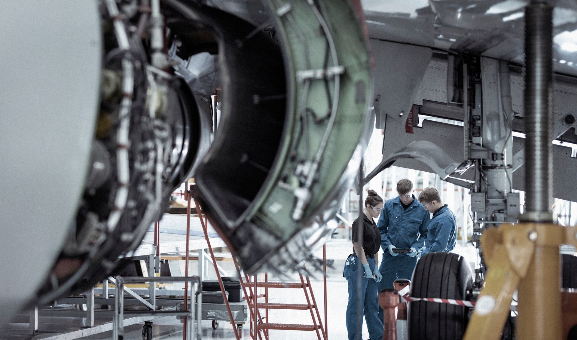 Aerospace MRO and manufacturing consulting with engineers in a hangar